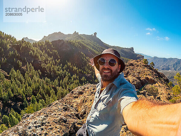 Selfie of a hiker at a Roque Nublo viewpoint in Gran Canaria  Canary Islands