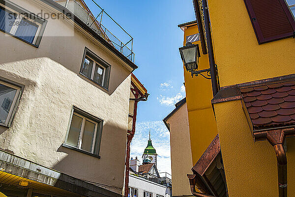 Historic architecture with a view of the church tower of St Martin in the old town of Wangen im Allgäu  Upper Swabia  Baden-Württemberg  Germany  Europe