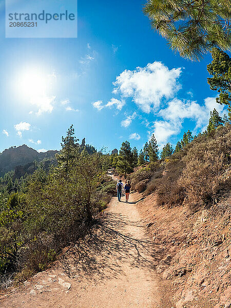 A couple of hikers on the trail up to Roque Nublo in Gran Canaria  Canary Islands