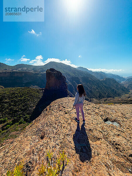 A woman tourist at the Roque Palmes viewpoint near Roque Nublo in Gran Canaria  Canary Islands