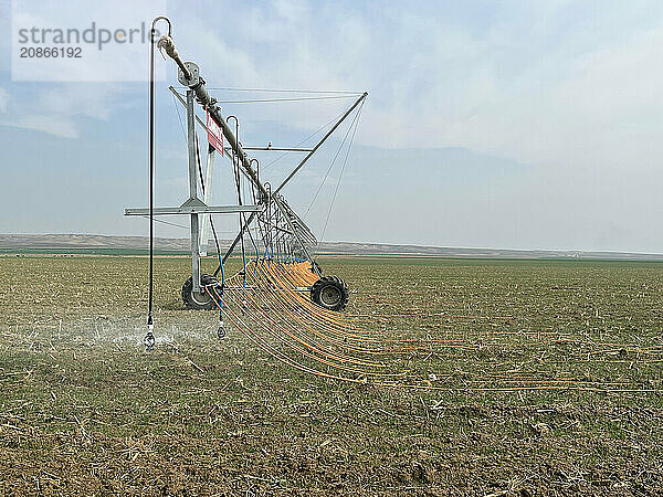 Irrigation system watering the field with a high pressure water jet