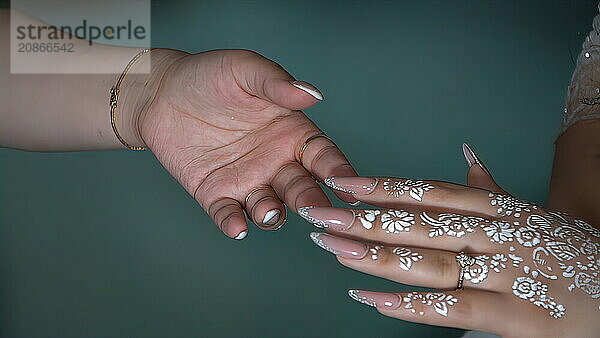 Hands of a bride and groom. Wedding manicure with white lace