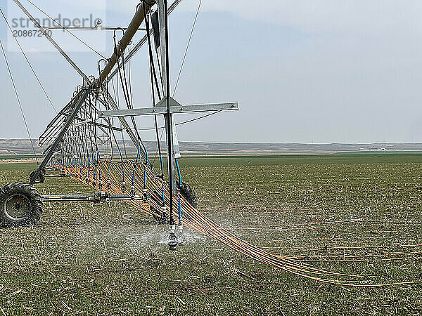 Irrigation system watering the field with a high pressure water jet