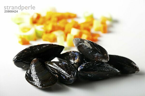 Mussels and vegetables on white