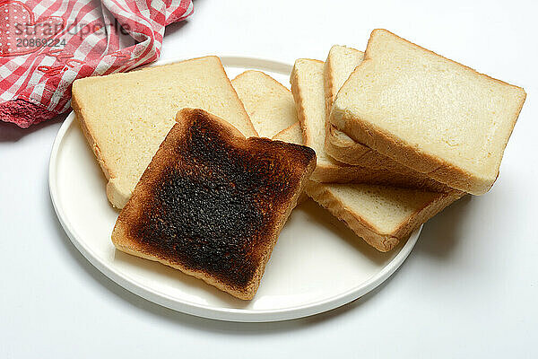 Burnt slice of toast with toast  toast