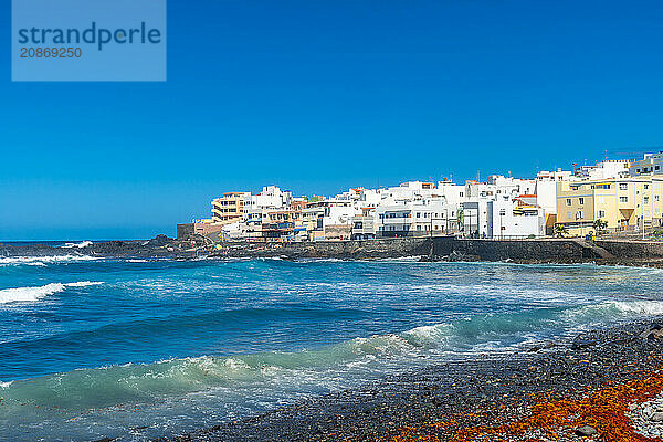 Beautiful beach in summer of Playa el Puertillo and its beautiful town in Gran Canaria. Spain