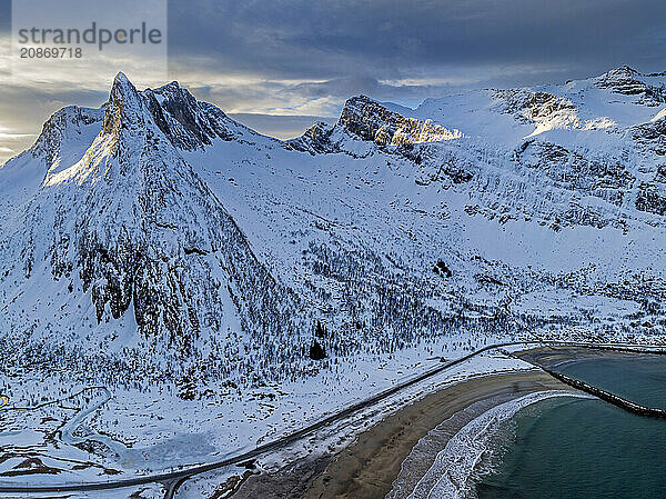 Aerial view of Bergen by the sea  coast  morning light  winter  snow  Senja  Troms  Norway  Europe