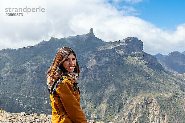 Portrait of a woman looking at Roque Nublo from a viewpoint on the mountain. Gran Canaria  Spain  Europe