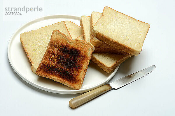 Burnt slice of toast with toast  toast