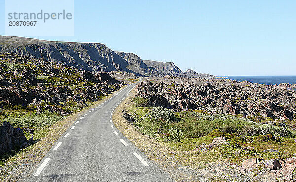 Single-lane coastal road to Hamningberg on the Barents Sea  Lapland  Northern Norway  Scandinavia