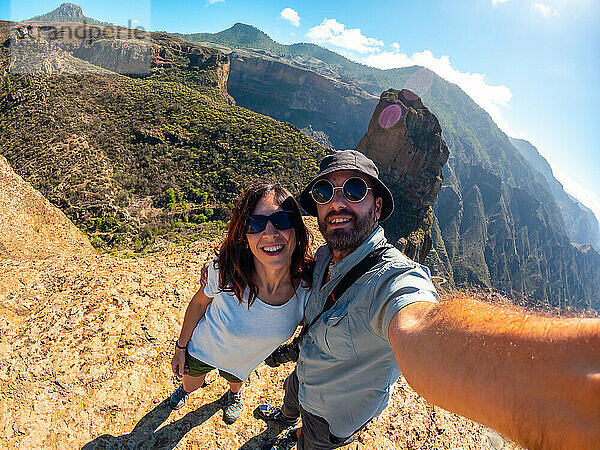 Selfie of a couple at the Roque Palmes viewpoint near Roque Nublo in Gran Canaria  Canary Islands