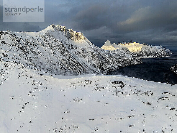 Aerial view of Bergen by the sea  coast  fjord  morning light  winter  snow  Senja  Troms  Norway  Europe