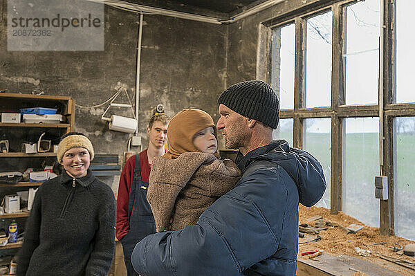 Family reunion in the workshop  father  daughter  son and grandson  Mecklenburg-Vorpommern  Germany  Europe