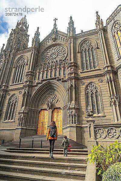 A mother with her son visiting the Church of San Juan Bautista  Arucas Cathedral  Gran Canaria  Spain  Europe