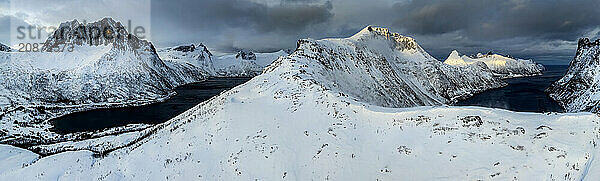 Aerial view of Bergen by the sea  coast  fjord  panorama  morning light  winter  snow  Senja  Troms  Norway  Europe