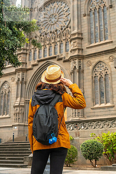 A tourist visiting the Church of San Juan Bautista  Arucas Cathedral  Gran Canaria  Spain  Europe