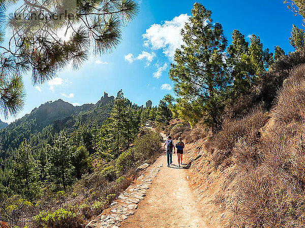 A couple of hikers on the trail up to Roque Nublo in Gran Canaria  Canary Islands