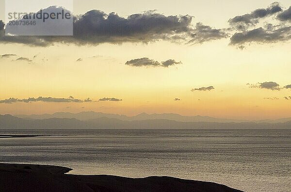 Sunrise landscape Red Sea coast with silhouette of high mountains and sky with clouds