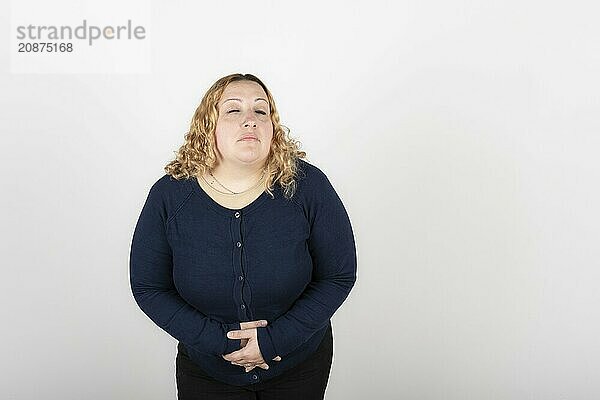 Woman with stomach ache on white background