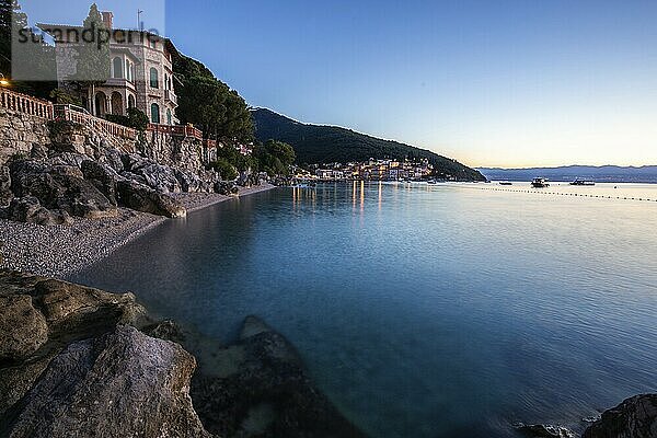 Beautiful historic skyline of a village on the Mediterranean  taken in the morning at sunrise on the beach and by the sea. Dreamlike harbour landscape in Mošcenicka Draga  Moscenicka Draga  Istria  Croatia  Europe