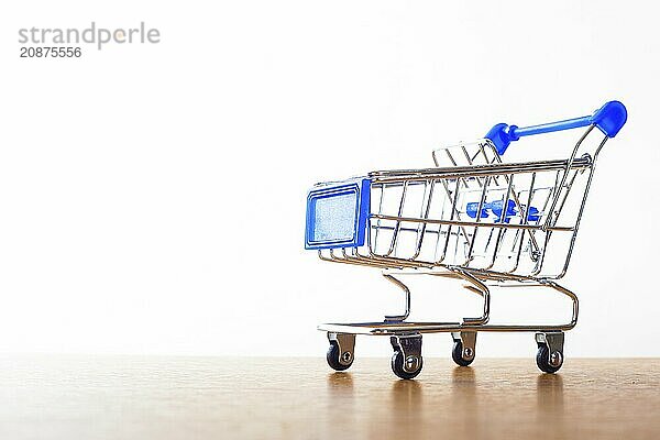 Shopping carts on the wooden floor. isolated on white