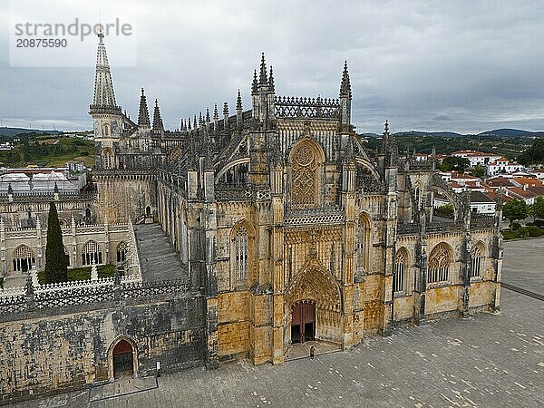 Impressive Gothic cathedral with a grand entrance and detailed towers under a cloudy sky  aerial view  monastery  Mosteiro de Santa Maria da Vitória  unfinished chapels  UNESCO World Heritage Site  Batalha  Leiria  Estremadura  Portugal  Europe