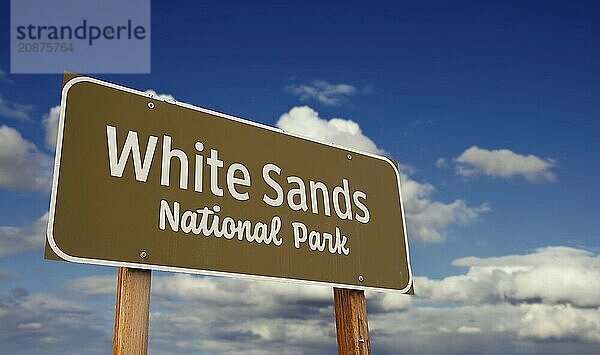 White sands national park (new Mexico) road sign against blue sky and clouds