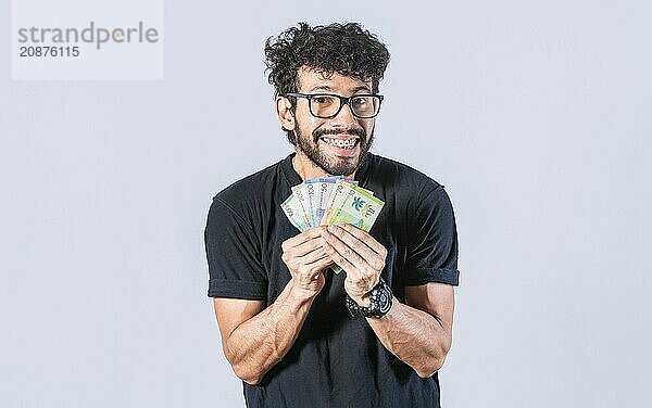 Happy man with money in hand  joyful man with bills in hand  concept of man with money isolated