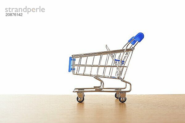 Shopping carts on the wooden floor. isolated on white