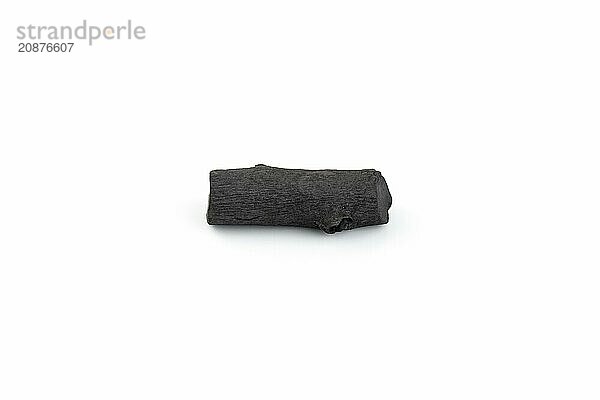 Natural wood charcoal isolated on white background. Pile of coal isolated on white background