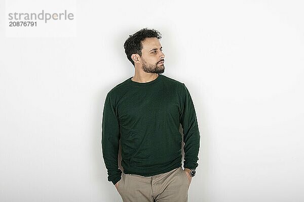 Portrait of a latin man looking to the side. White background