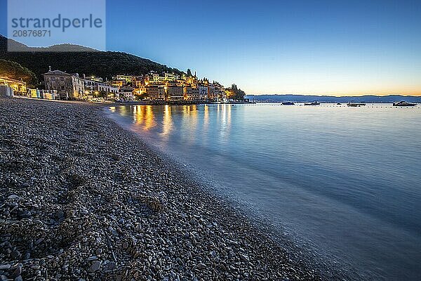 Beautiful historic skyline of a village on the Mediterranean  taken in the morning at sunrise on the beach and by the sea. Dreamlike harbour landscape in Mošcenicka Draga  Moscenicka Draga  Istria  Croatia  Europe