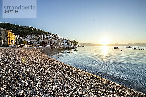 Beautiful historic skyline of a village on the Mediterranean  taken in the morning at sunrise on the beach and by the sea. Dreamlike harbour landscape in Mošcenicka Draga  Moscenicka Draga  Istria  Croatia  Europe