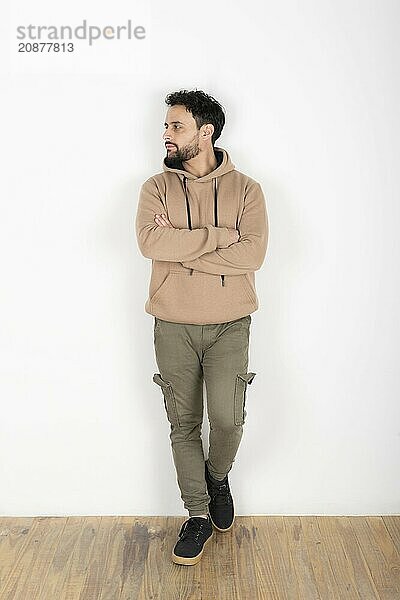 Portrait of a latin man looking to the side. White background