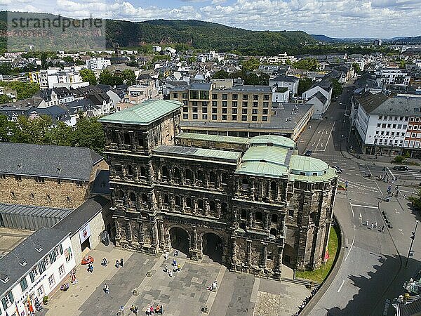 Historical architecture of the Porta Nigra with city view and green roofs in Germany  aerial view  Porta Nigra  Black Gate  Roman city gate  Trier  Rhineland-Palatinate  Germany  Europe