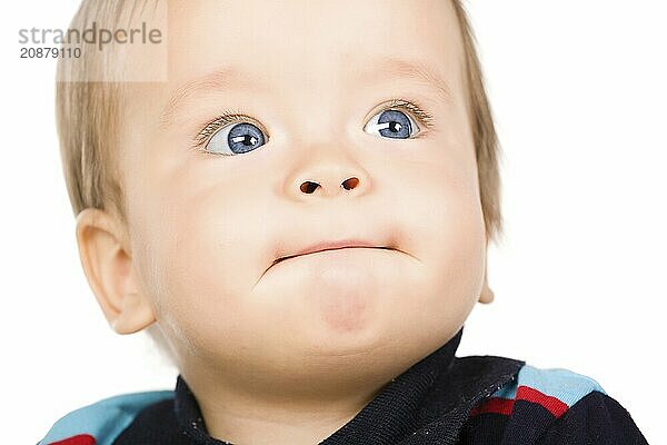 The blue-eyed baby  close-up. Isolated on white