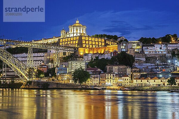 View of Vila Nova de Gaia city with Mosteiro da Serra do Pilar monastery and Dom Luis I bridge over Douro river in evening twilight. Porto  Vila Nova de Gaia  Portugal  Europe