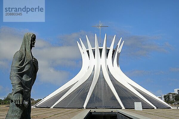 St Luke the Evangelist statue by Alfredo Ceschiatti and Dante Croce in front of Roman Cathedral of Brasília or Metropolitan Cathedral  designed by Oscar Niemeyer  World Heritage Site  Brasilia  Federal district  Brazil  South America