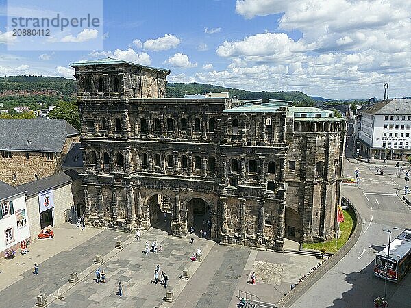 Historical architecture in sunny weather  tourists visiting Porta Nigra in Germany  aerial view  Porta Nigra  Black Gate  Roman city gate  Trier  Rhineland-Palatinate  Germany  Europe