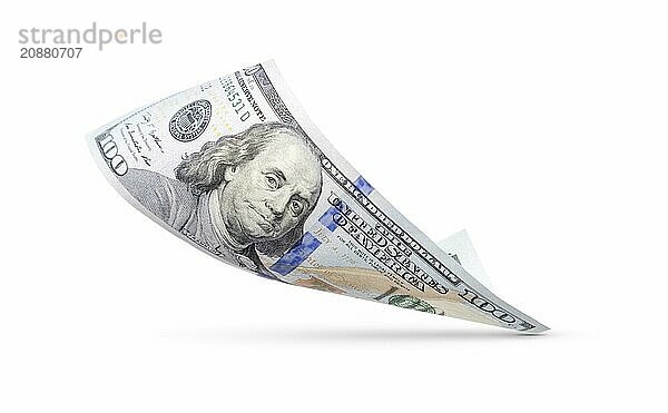 One hundred dollar bill floating down to surface with drop shadow isolated on a white background