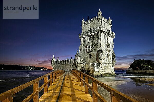 Belem Tower or Tower of St Vincent  famous tourist landmark of Lisboa and tourism attraction  on the bank of the Tagus River (Tejo) after sunset in dusk twilight with dramatic sky. Lisbon  Portugal  Europe