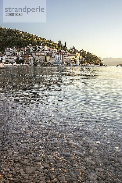 Beautiful historic skyline of a village on the Mediterranean  taken in the morning at sunrise on the beach and by the sea. Dreamlike harbour landscape in Mošcenicka Draga  Moscenicka Draga  Istria  Croatia  Europe