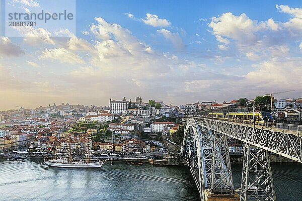 View of Porto city and Douro river and Dom Luis bridge I with tram from famous tourist viewpoint Miradouro do Jardim do Morro on sunset. Porto  Vila Nova de Gaia  Portugal  Europe