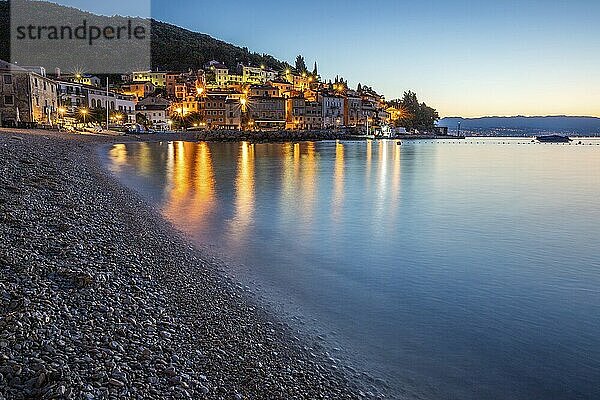 Beautiful historic skyline of a village on the Mediterranean  taken in the morning at sunrise on the beach and by the sea. Dreamlike harbour landscape in Mošcenicka Draga  Moscenicka Draga  Istria  Croatia  Europe