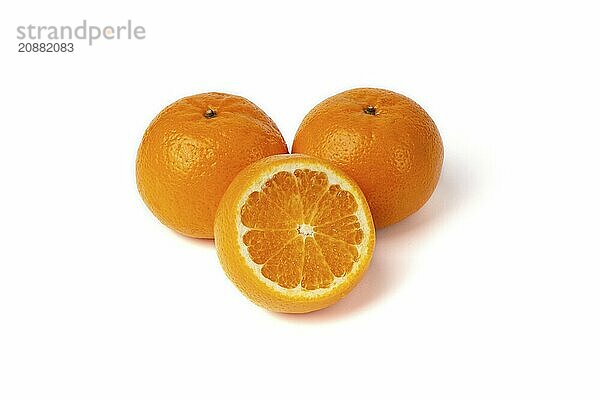 The orange fruit is isolated on a white background with orange slices