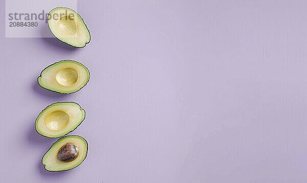 Fresh avocado halves with pit on a pastel purple background AI generated