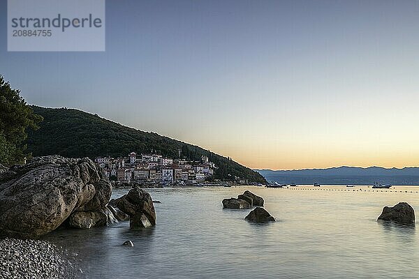 Beautiful historic skyline of a village on the Mediterranean  taken in the morning at sunrise on the beach and by the sea. Dreamlike harbour landscape in Mošcenicka Draga  Moscenicka Draga  Istria  Croatia  Europe