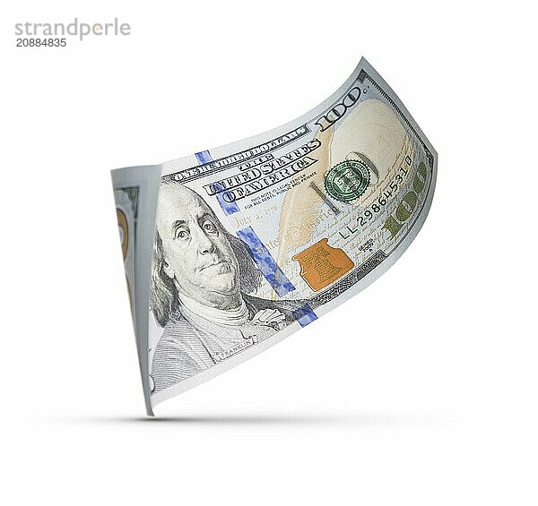 One hundred dollar bill floating down to surface with drop shadow isolated on a white background