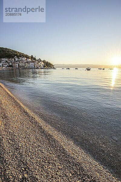 Beautiful historic skyline of a village on the Mediterranean  taken in the morning at sunrise on the beach and by the sea. Dreamlike harbour landscape in Mošcenicka Draga  Moscenicka Draga  Istria  Croatia  Europe