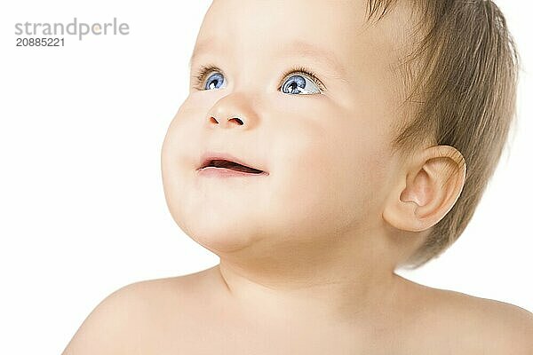 The blue-eyed baby  close-up. Isolated on white